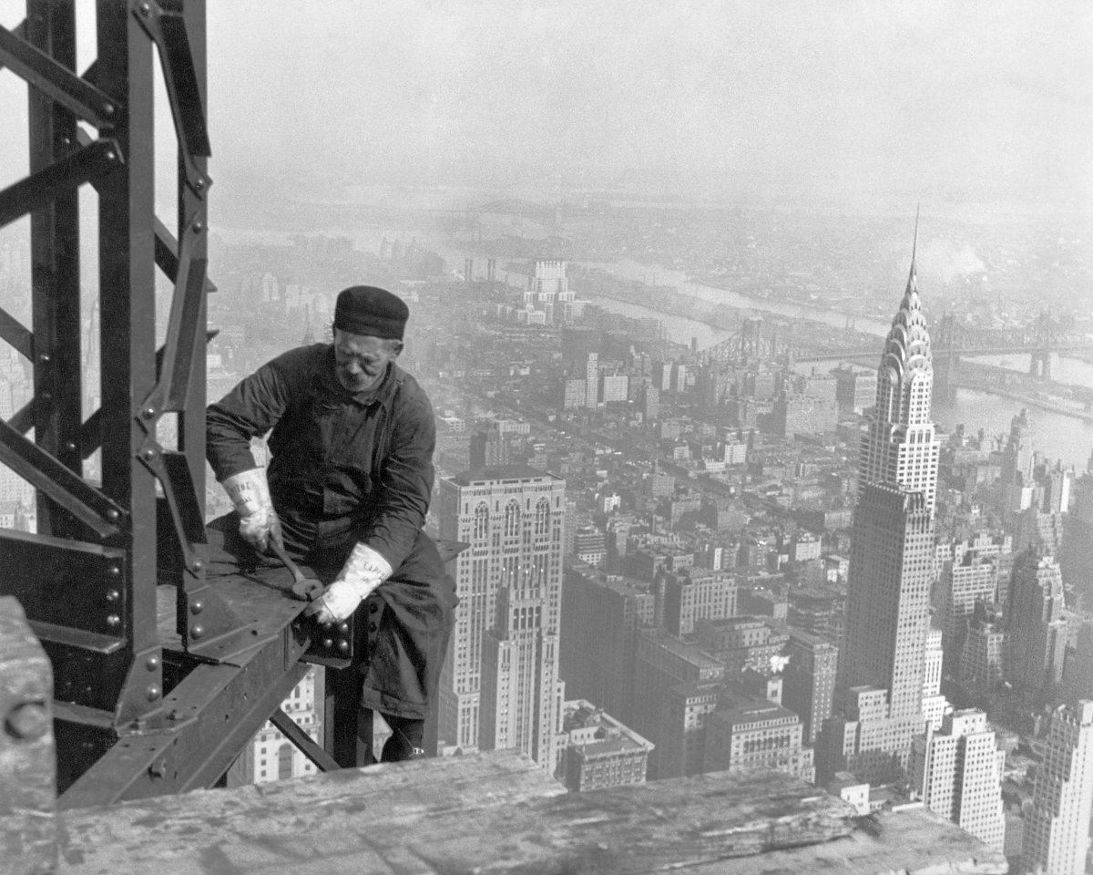 Worker on the edge of the Empire State Building