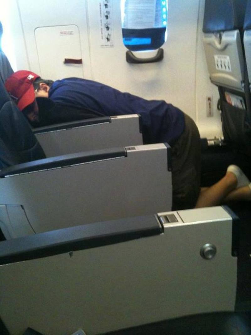 Flight Passenger Hugs Seat to Sleep