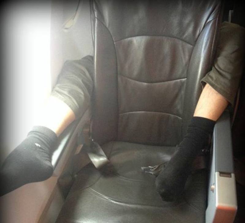 Passenger's Legs Wrapped Around Seat