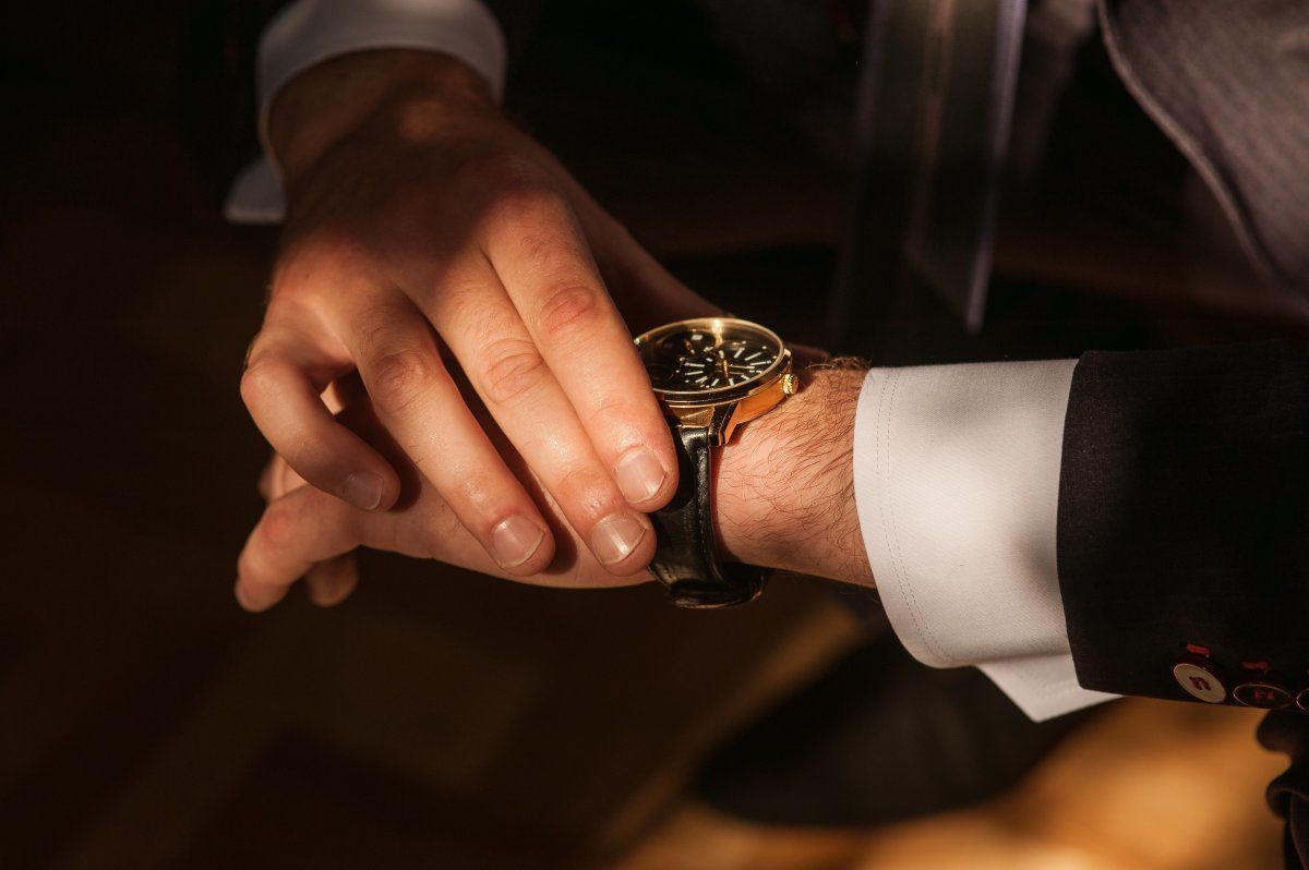 Businessman Looking At His Watch for Punctuality
