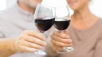 Clinking Glasses With Red Wine