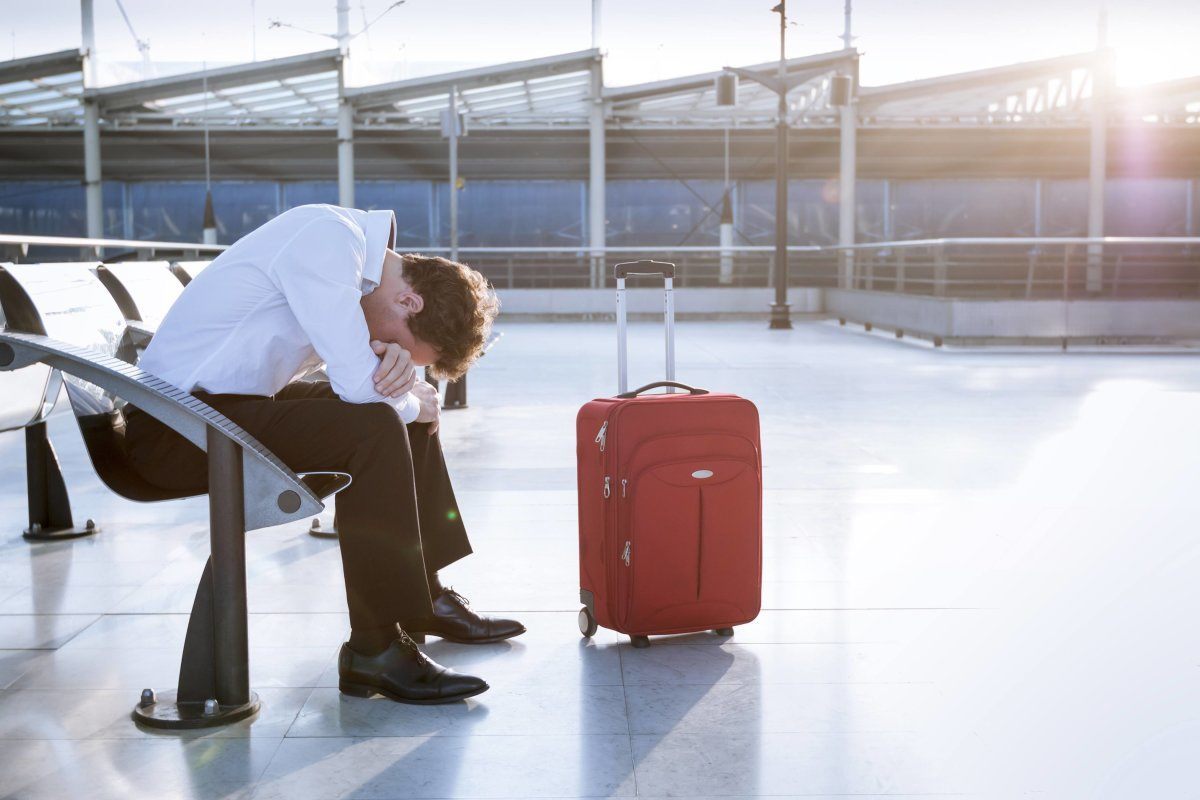 Depressed Traveler Waiting At Airport