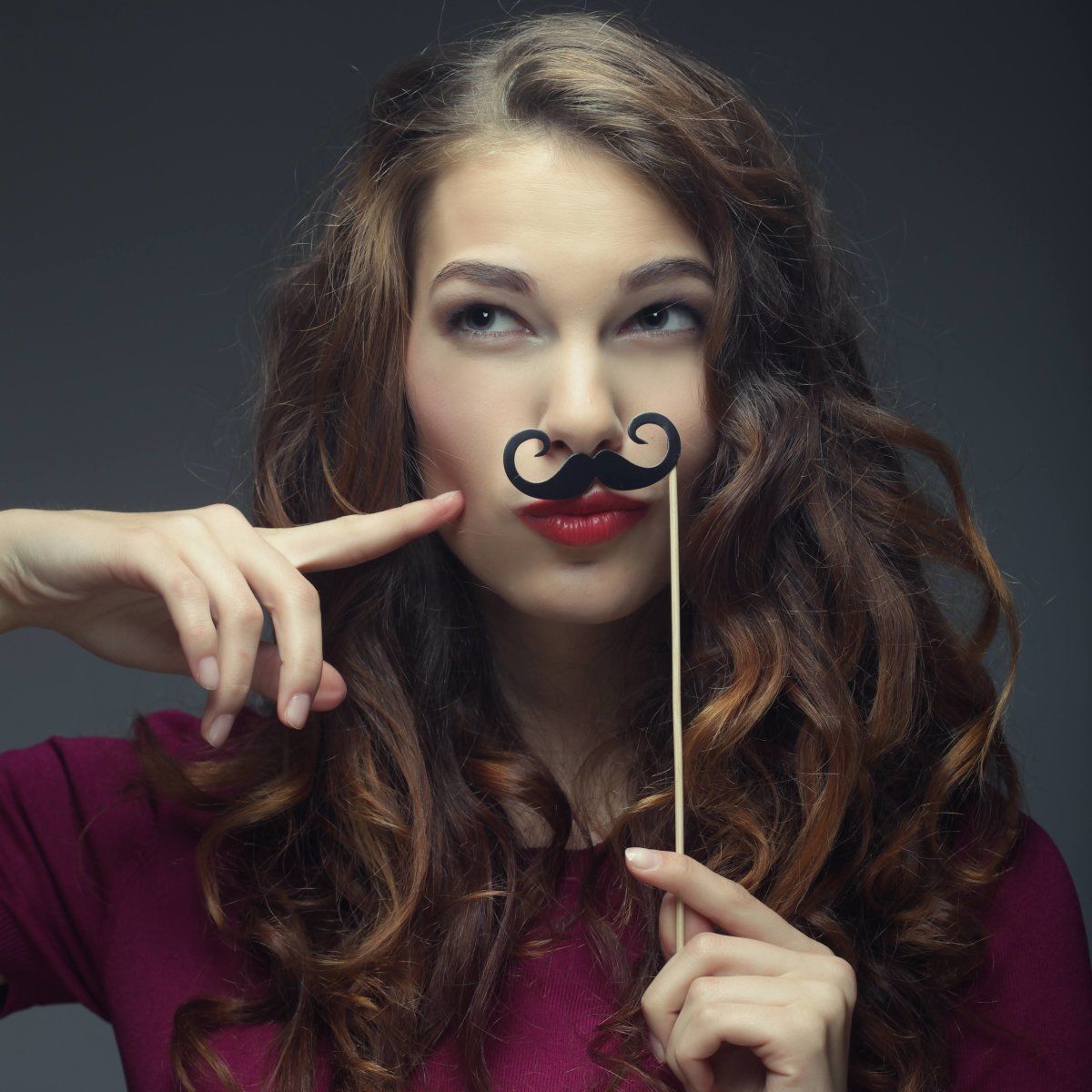 Girl Wearing Fake Mustache