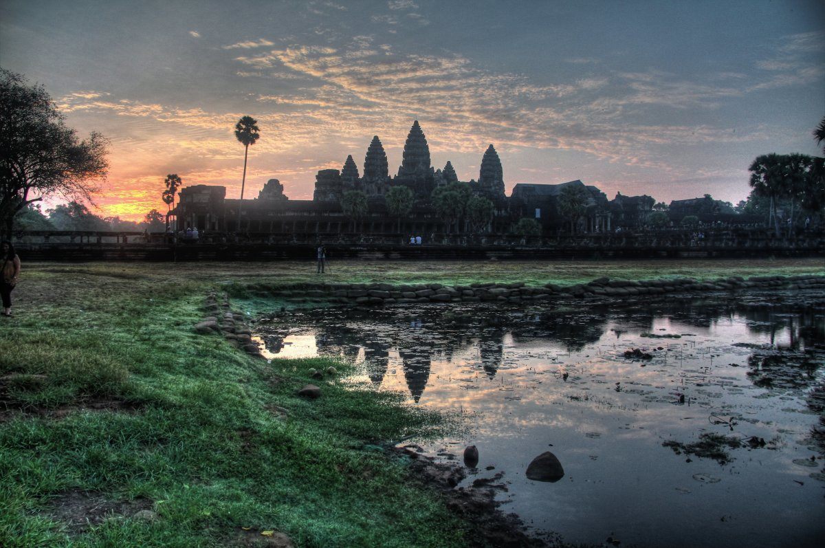 The Angkor Wat Temple At Sunrise In Cambodia