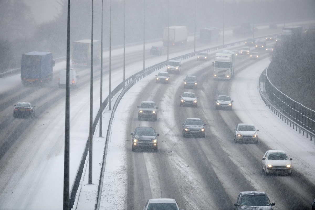 Traffic On Motorway During Snowstorm
