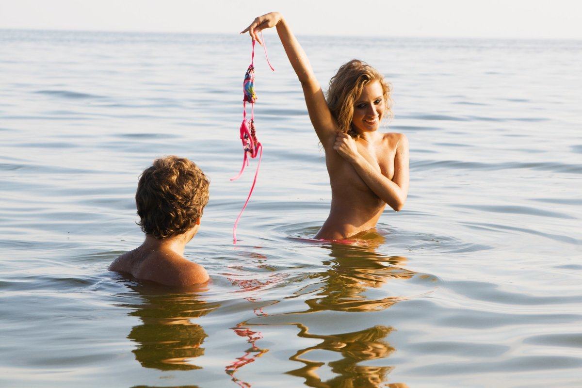 Pretty Sexy Girl In The Water And Flirting With Her Boyfriend