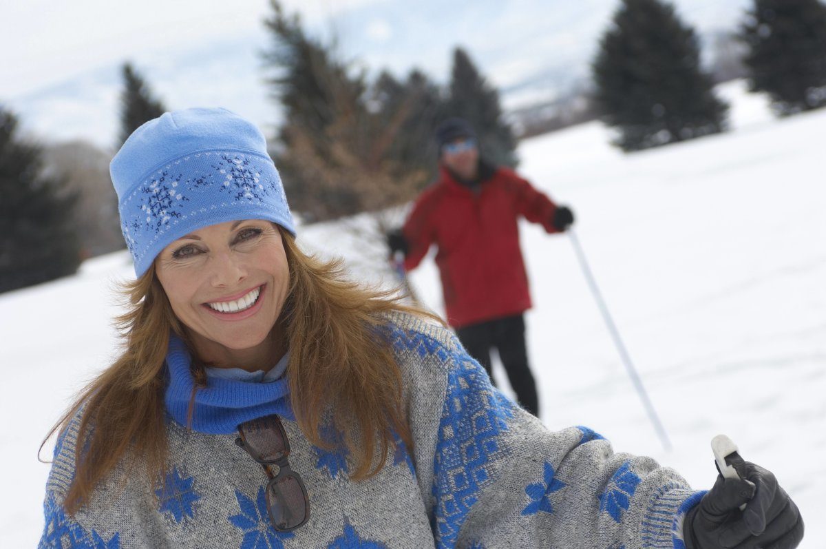 Smiling Woman Cross Country Skiing
