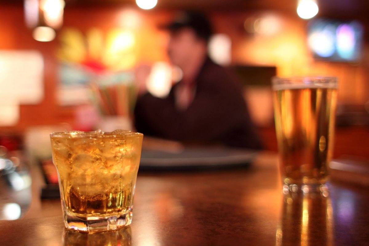 Whiskey On The Rocks And A Glass Of Beer At A Dive Bar.