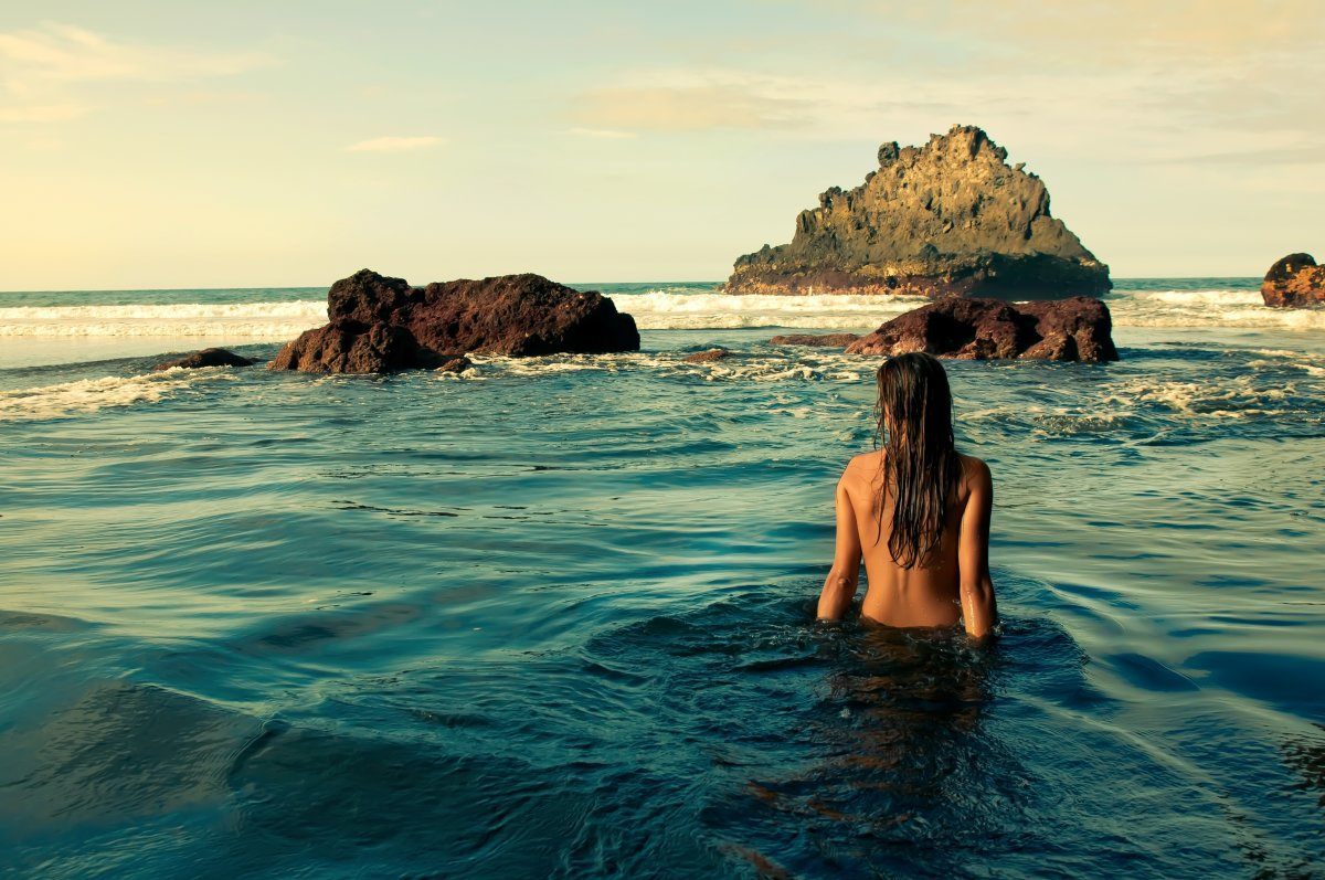 Young Nude Woman In The Sea