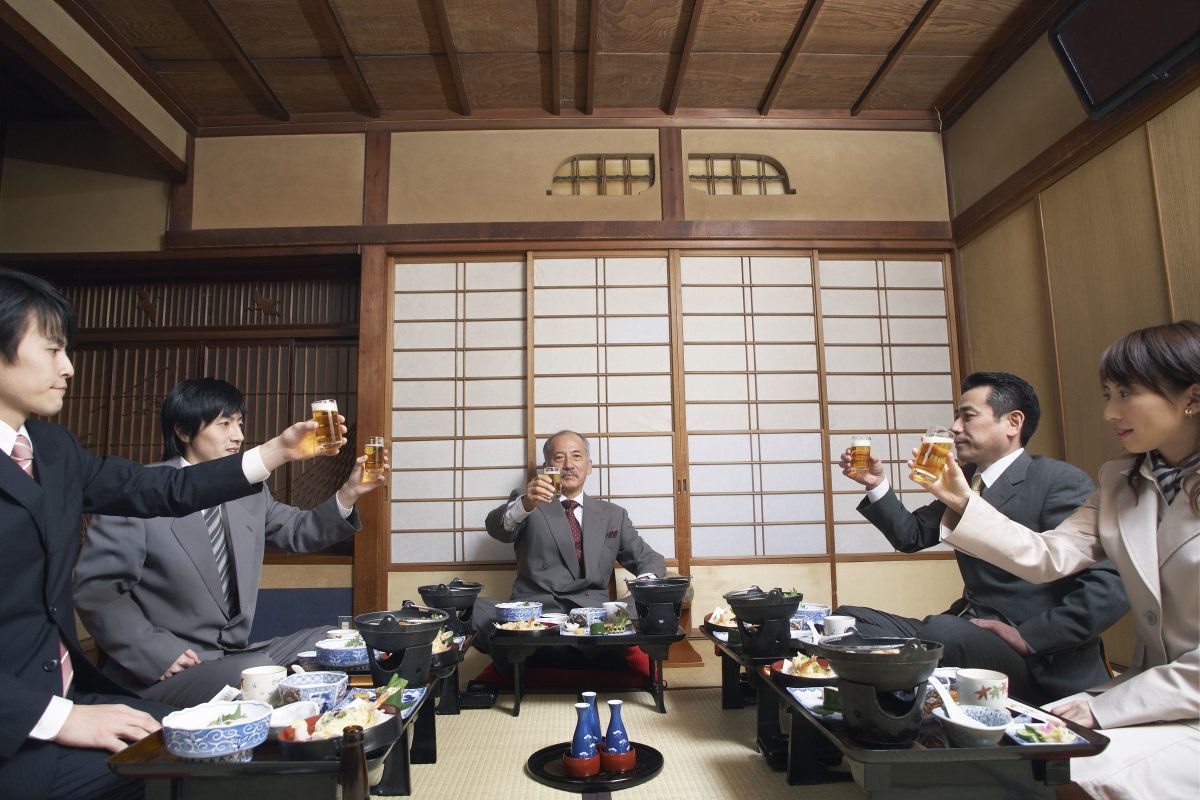 Businesspeople Toasting With Beer