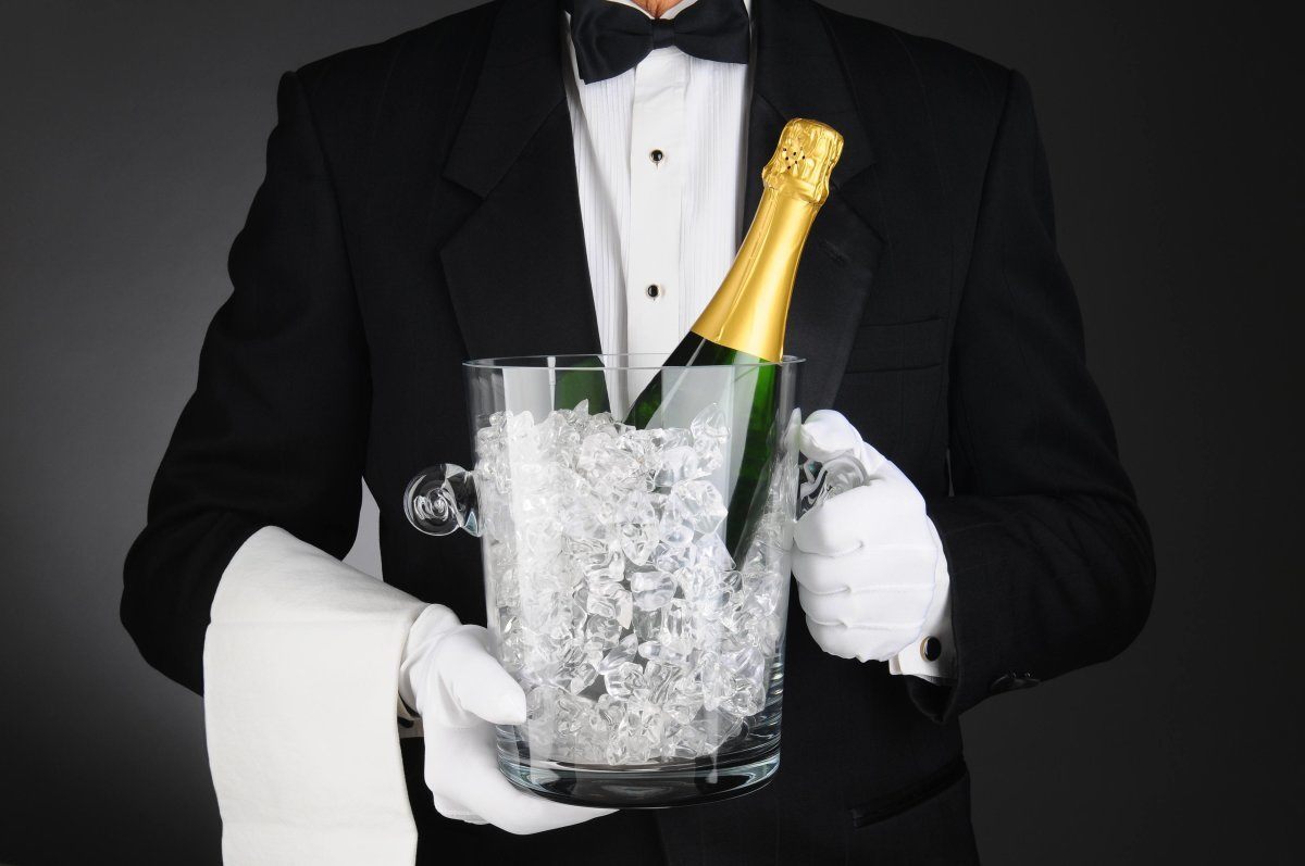 Closeup Of A Sommelier Holding A Champagne Ice Bucket