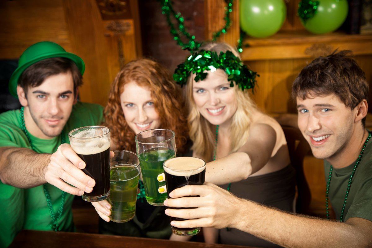 Group Of Friends Celebrating St. Patricks Day At A Pub.