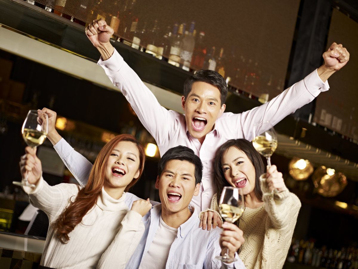 Young Asian Friends Enjoying Party In Pub