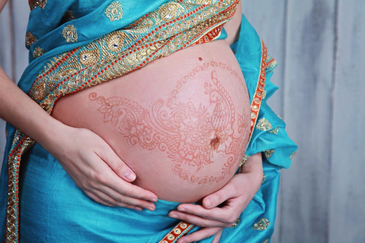 Pregnant Belly With Henna Tattoos In Sari
