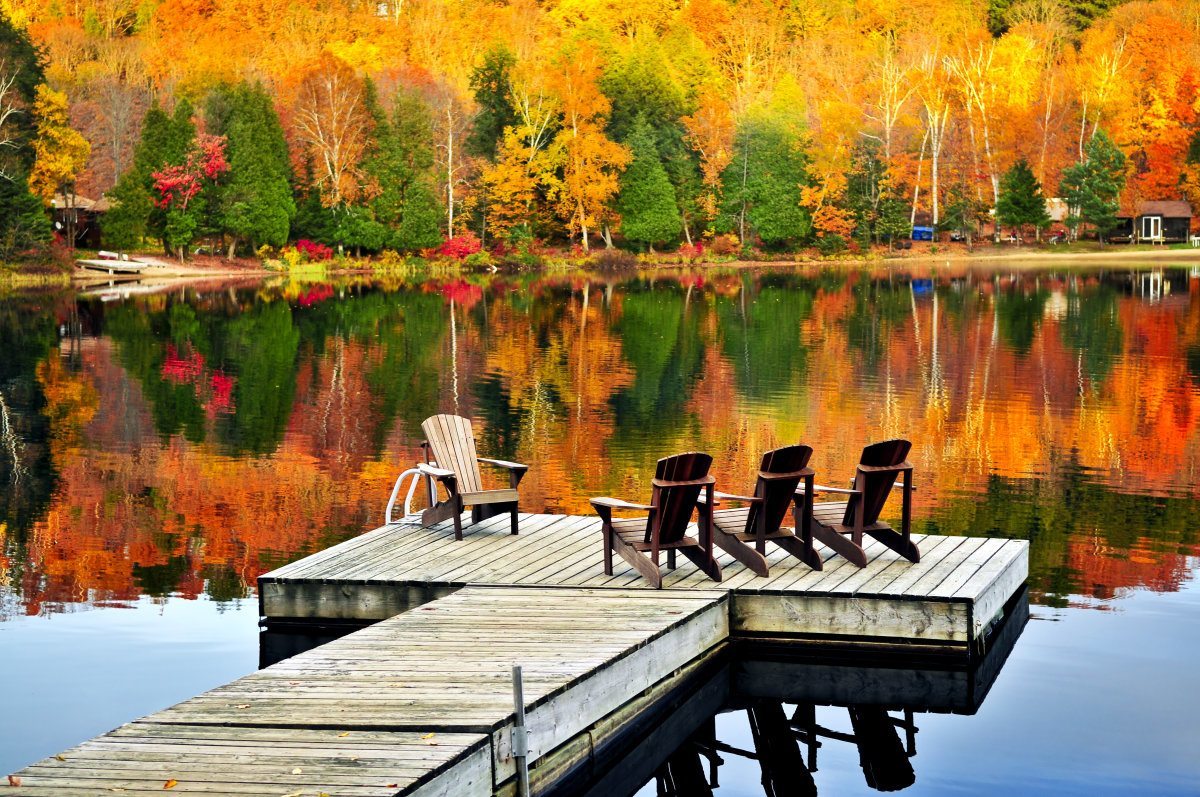 Wooden Dock With Chairs On Lake