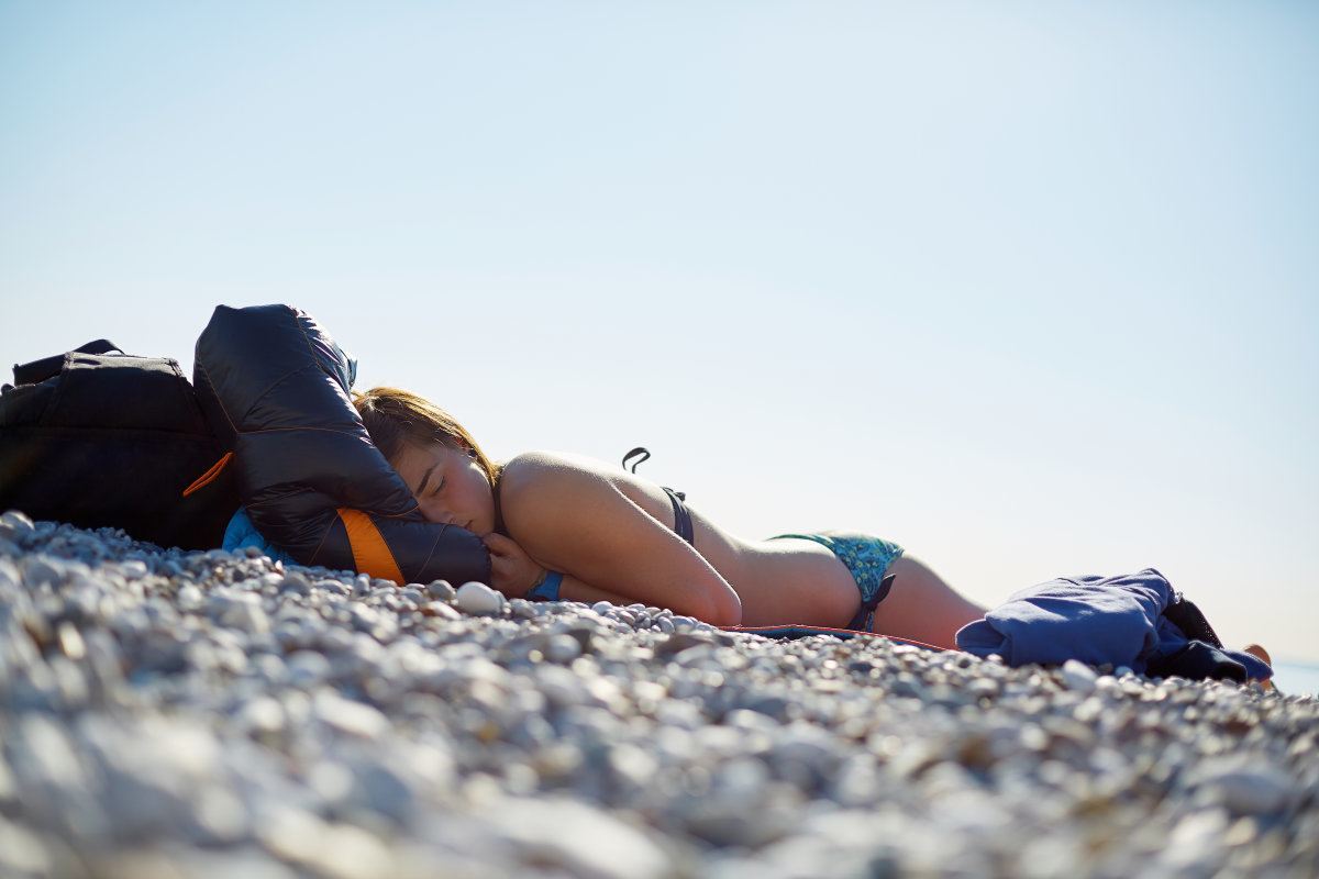 Girl Wearing In Bikini Sleeping On The Beach
