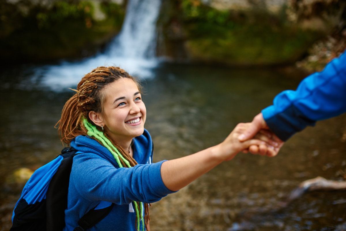 Hiker Woman Getting Help On Hike