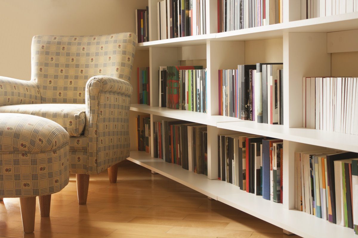 Home Library With Arm Chair. Clean And Modern Decoration.