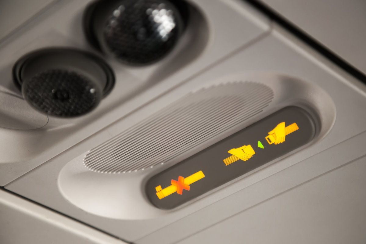 No Smoking And Fasten Seat Belt Sign Inside An Airplane
