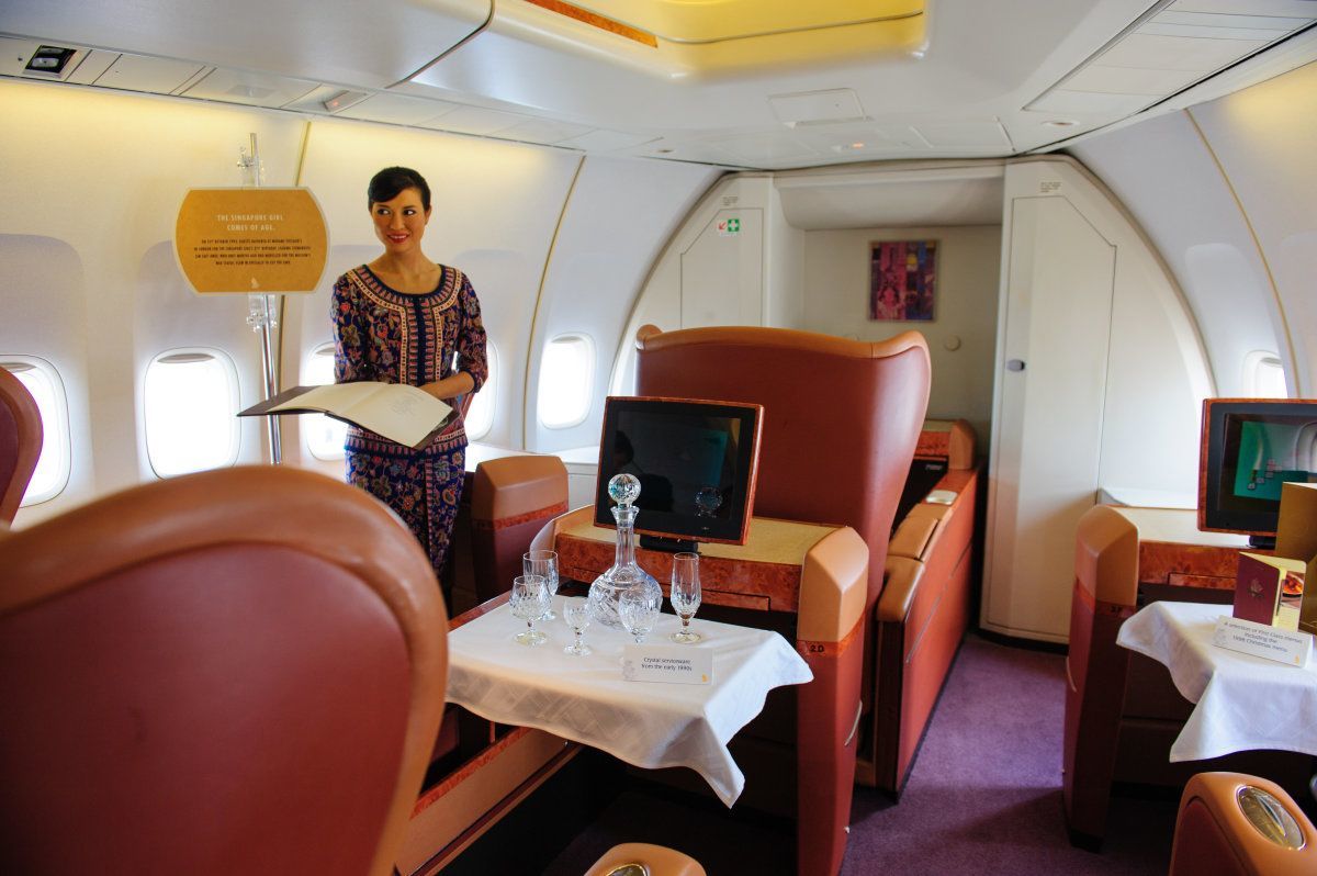 Singapore - February 12: First Class Cabin With Singapore Girl In Singapore Airlines' (Sia) Last Boeing 747-400 Aircraft At Singapore Airshow February 12, 2012 In Singapore