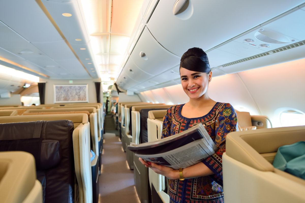 Singapore - November 10, 2015: Singapore Airlines Crew Member On Board Of Airbus A380. Singapore Airlines Limited Is The Flag Carrier Of Singapore Which Operates From Its Hub At Changi Airport