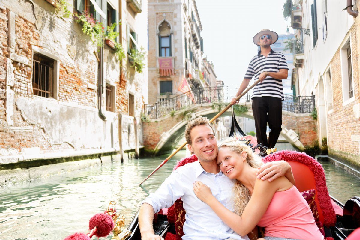 Romantic couple in Venice on Gondola ride. Italy, Europe.