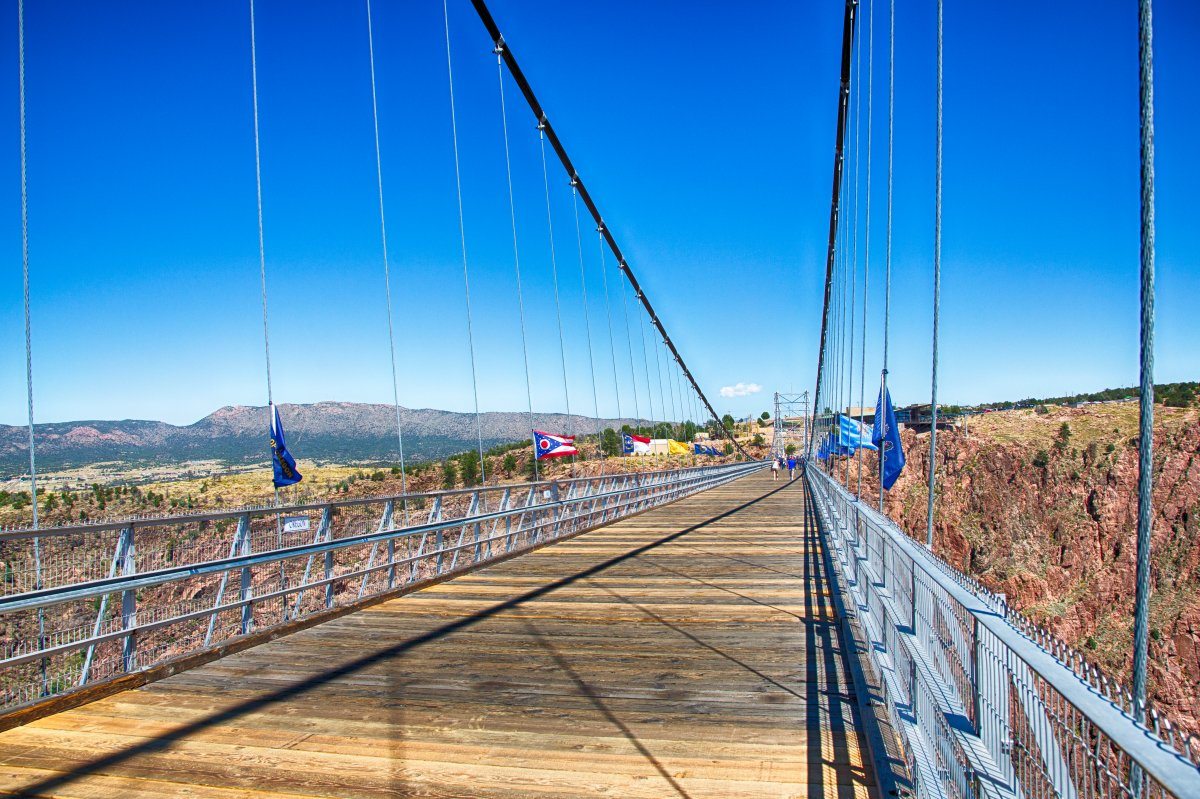 Tourists cross the royal gorge bridge in Colorado