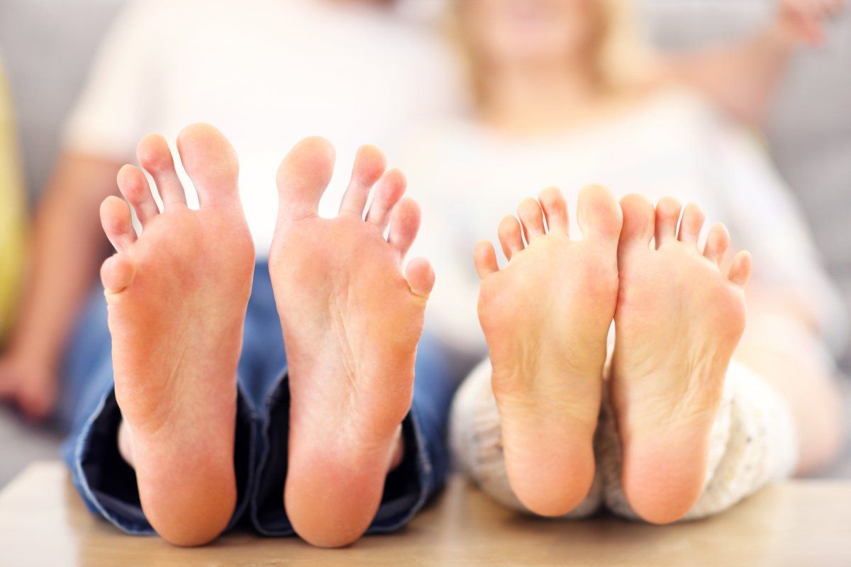 A Picture Of Barefeet Couple