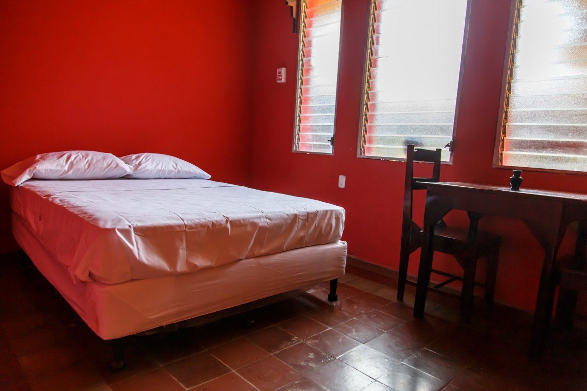 Hostel Room With Red Wall