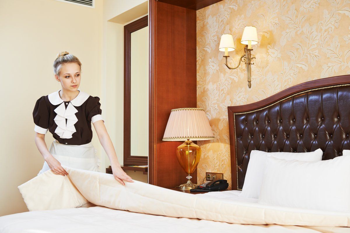 Housekeeping Worker Maid Making Bed