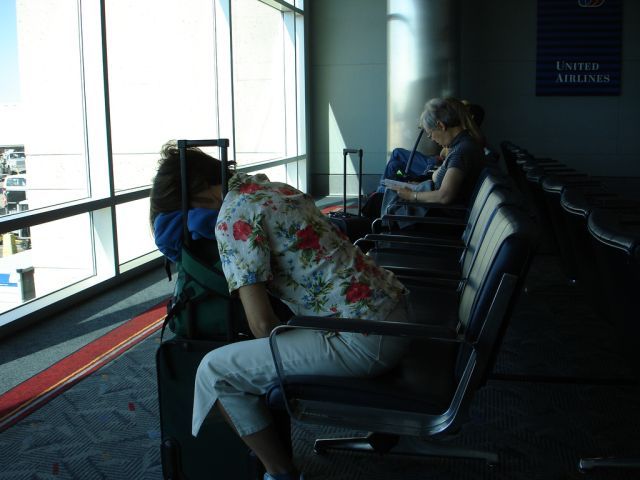 sleeping on suitcase