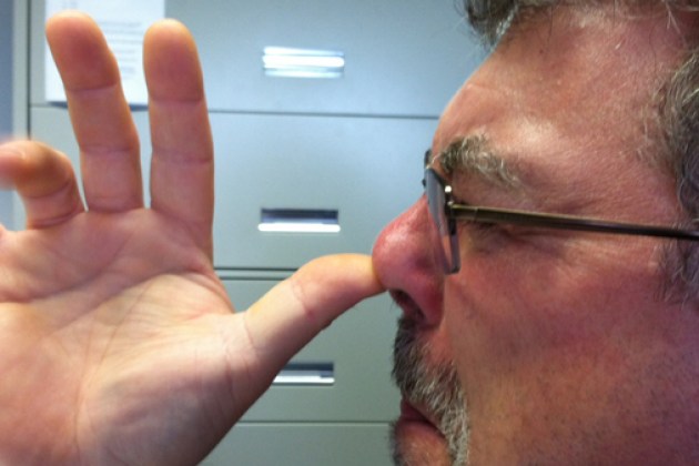 thumb on nose
