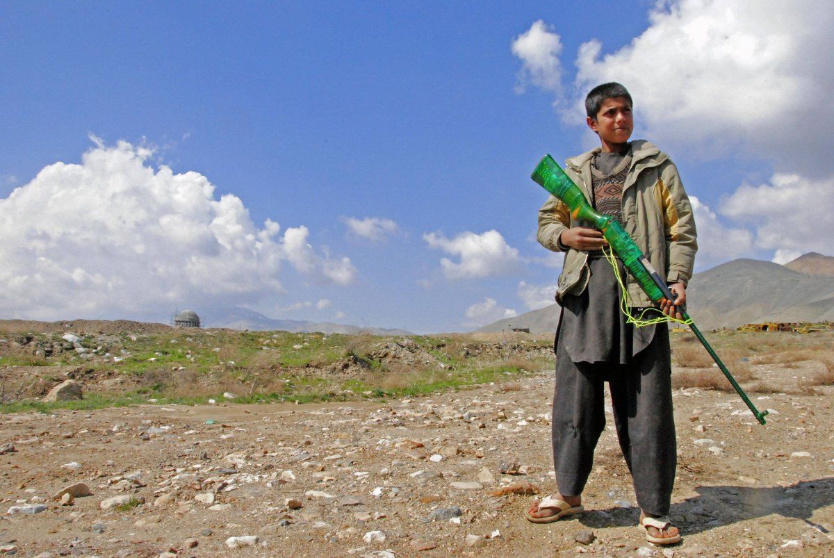 Afghan Shepherd with Toy Gun