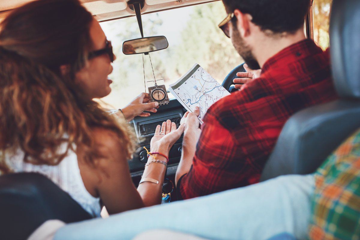 Couple In Car Reading Map