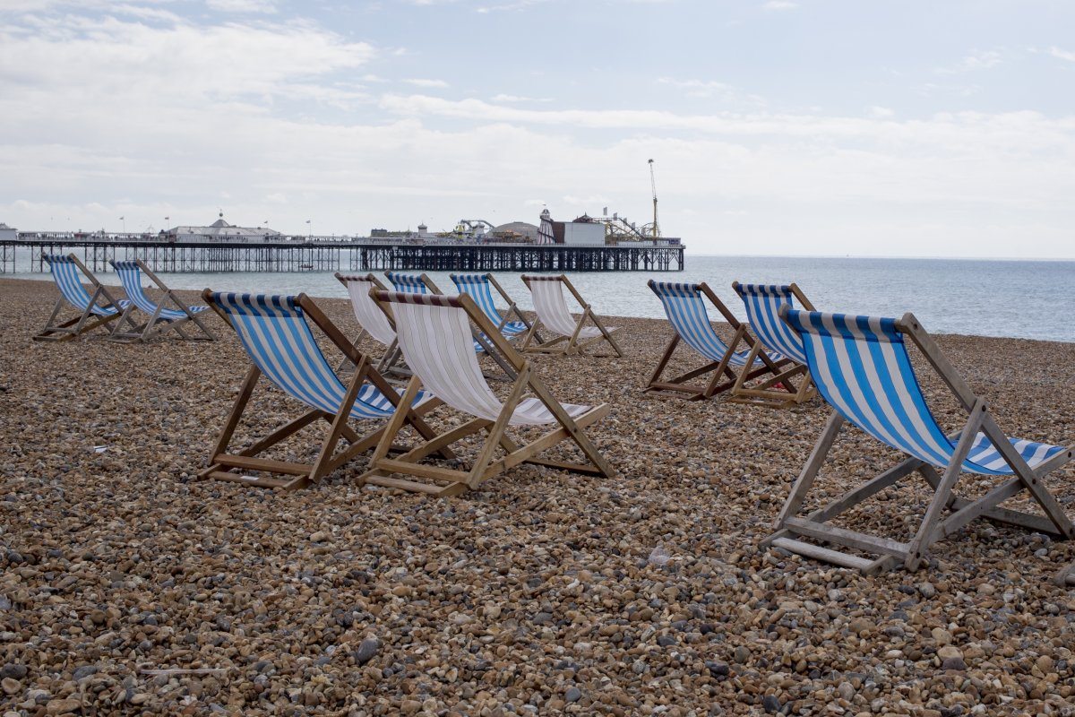 Deck Chairs On Brighton Beach - Uk