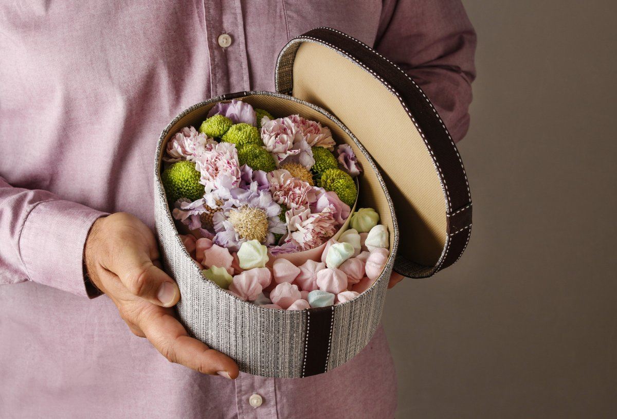 Man With Sweets And Flowers