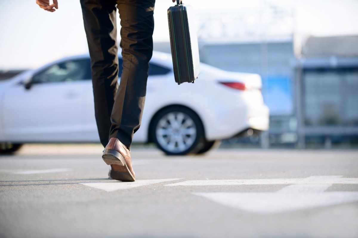Modern Young Businessman Holding Case