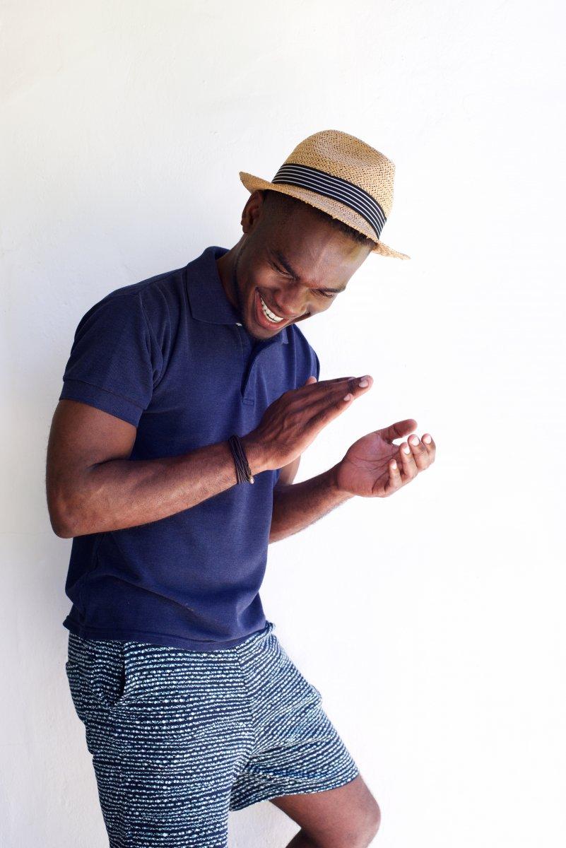 Portrait Of Happy Young African Man Clapping Hands