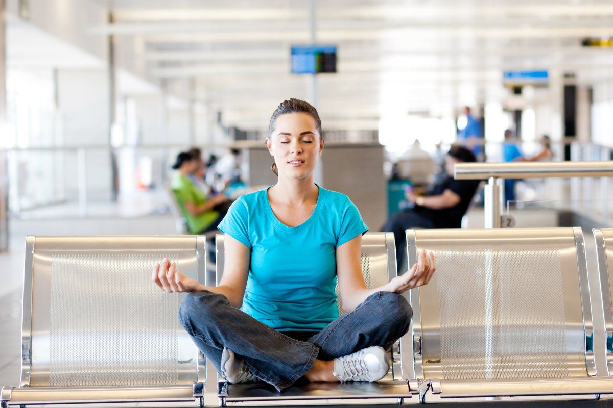 Woman Doing Yoga At Airport