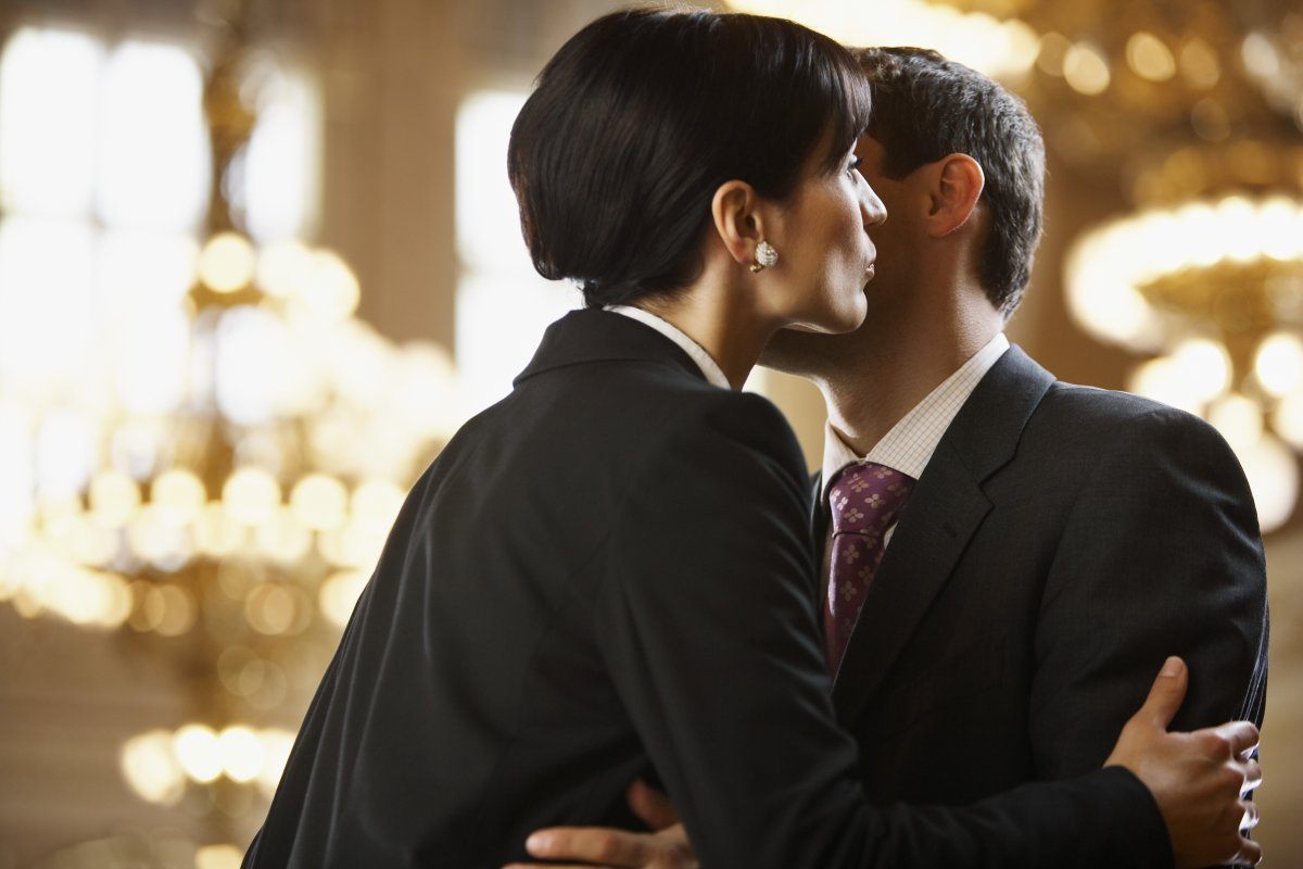 Woman Kissing Man On Cheek