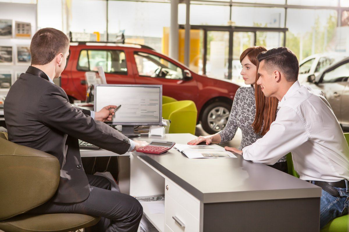 Young Couple Chooses A Car