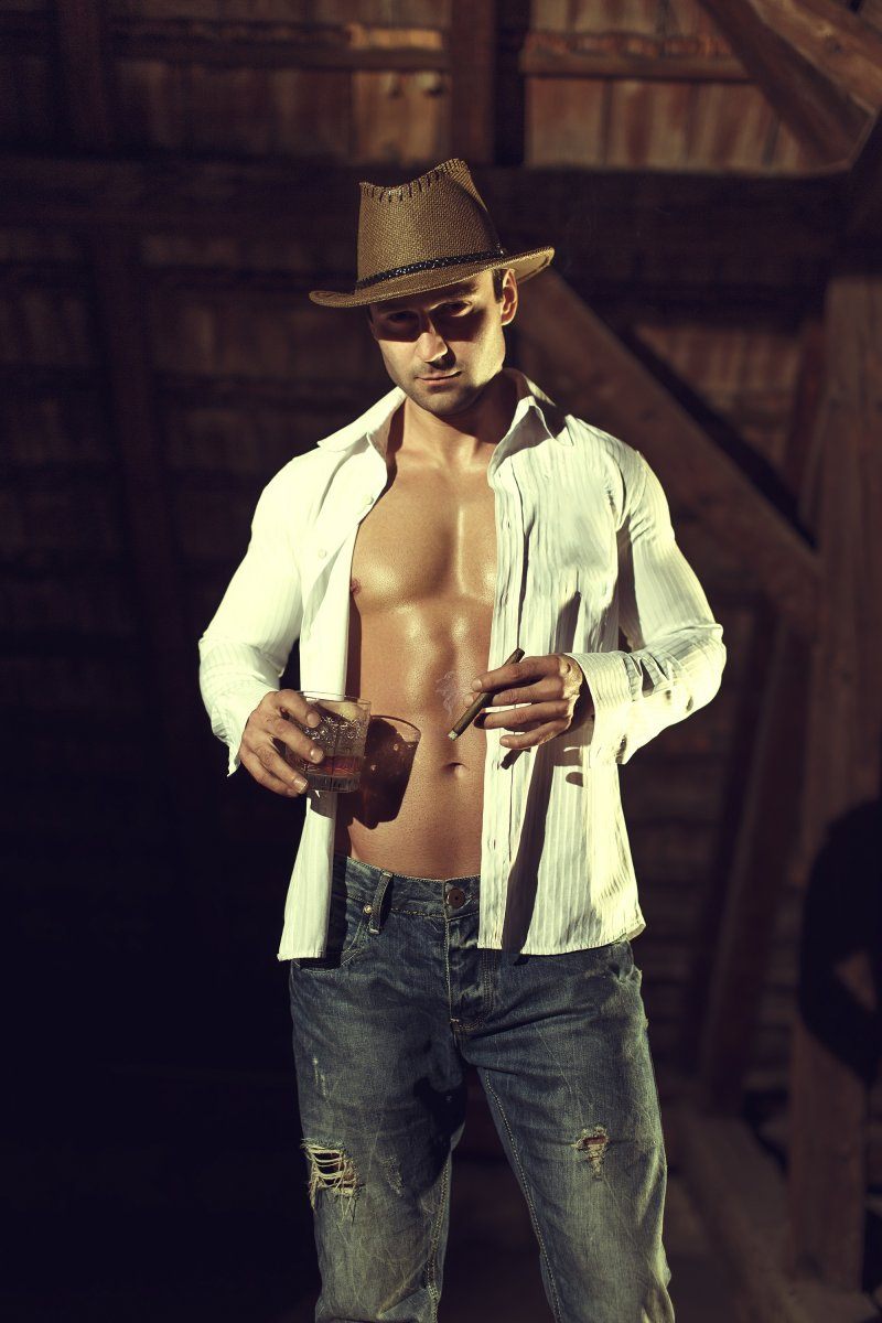 Sexy Macho Cowboy In Barn With Whiskey And Cigar