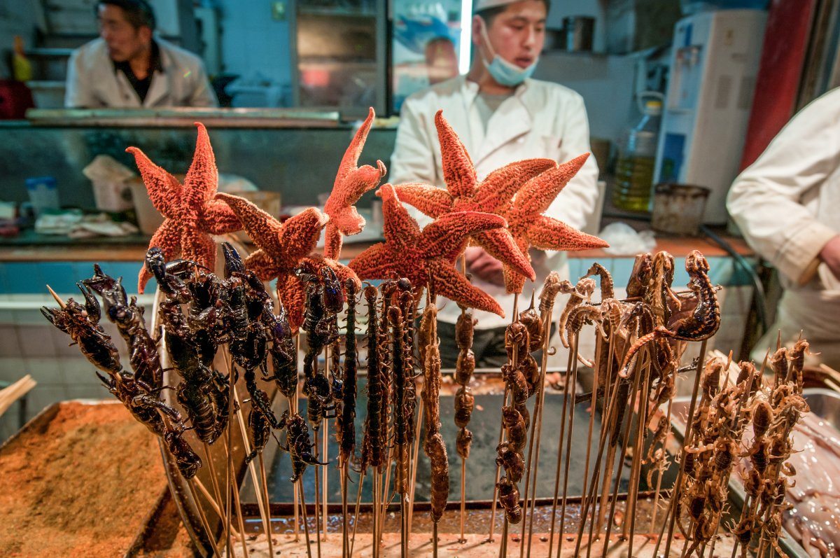 Beijing, China - night market Food Stall Serving Exotic Food
