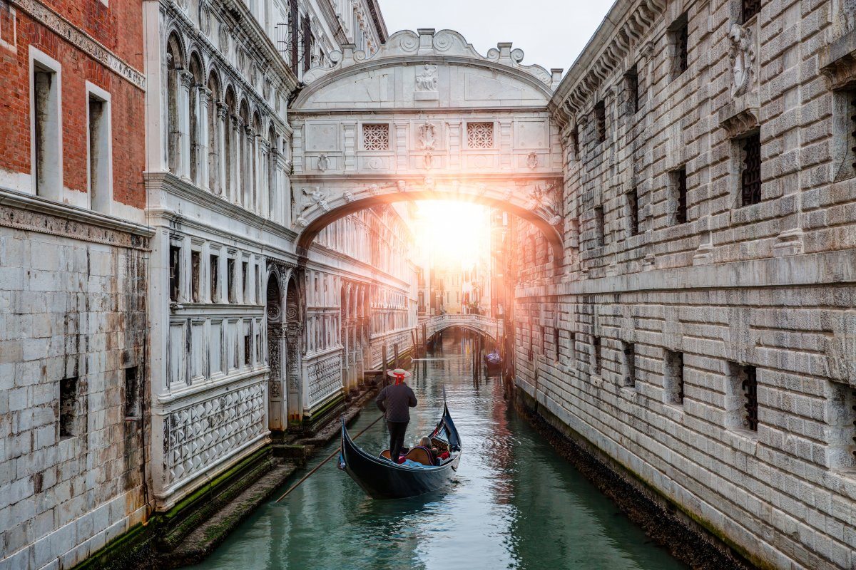 Gondolas Floating On Canal Towards Bridge Of Sighs