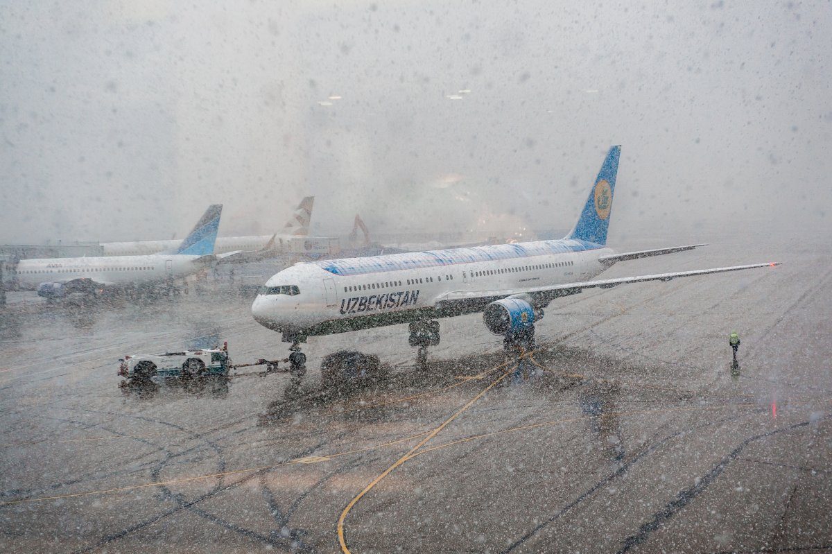 Moscow, Russia - Circa February 2015. Uzbekistan Airlines Airplane Preparing For Take-Off At Domodedovo Airport, In Bad Weather.