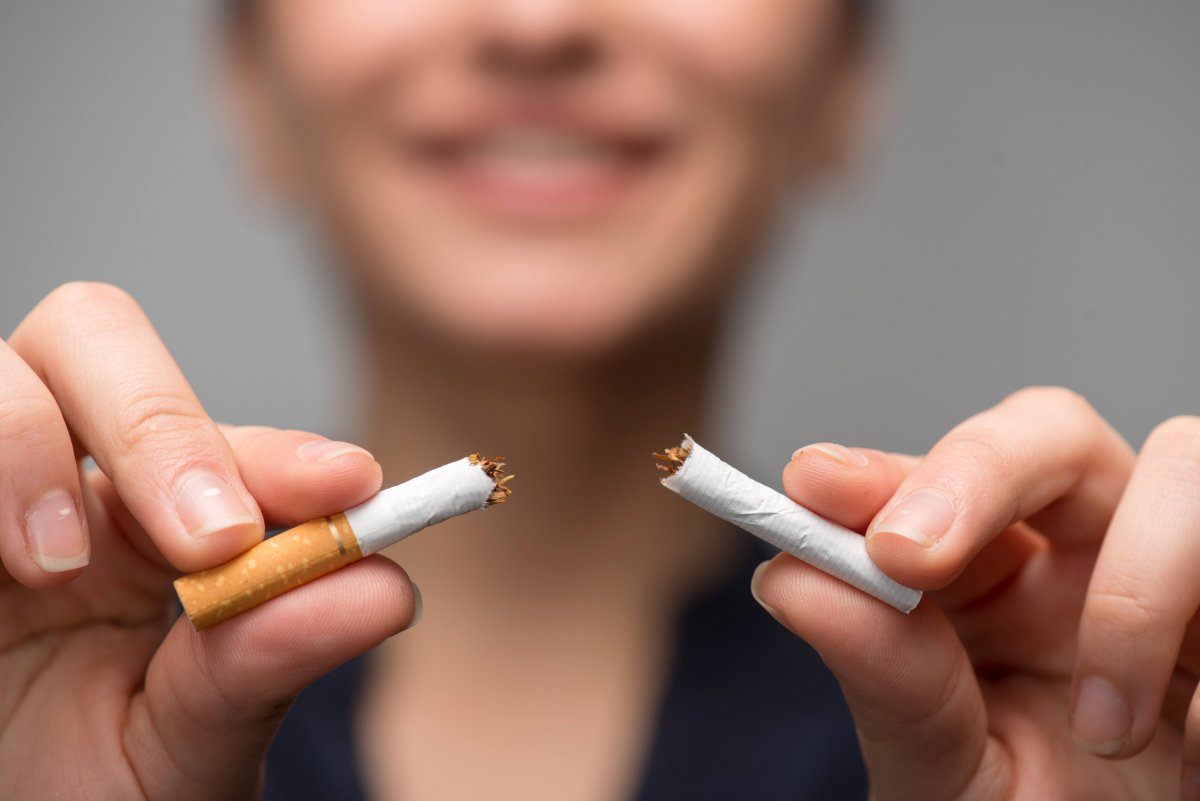 Woman Breaking Down Cigarette