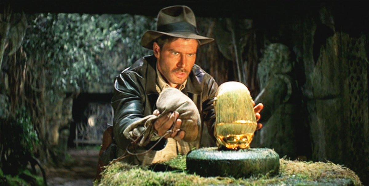 A scene from the movie Raider of the Lost Ark where Indiana Jones negotiates a booby trap