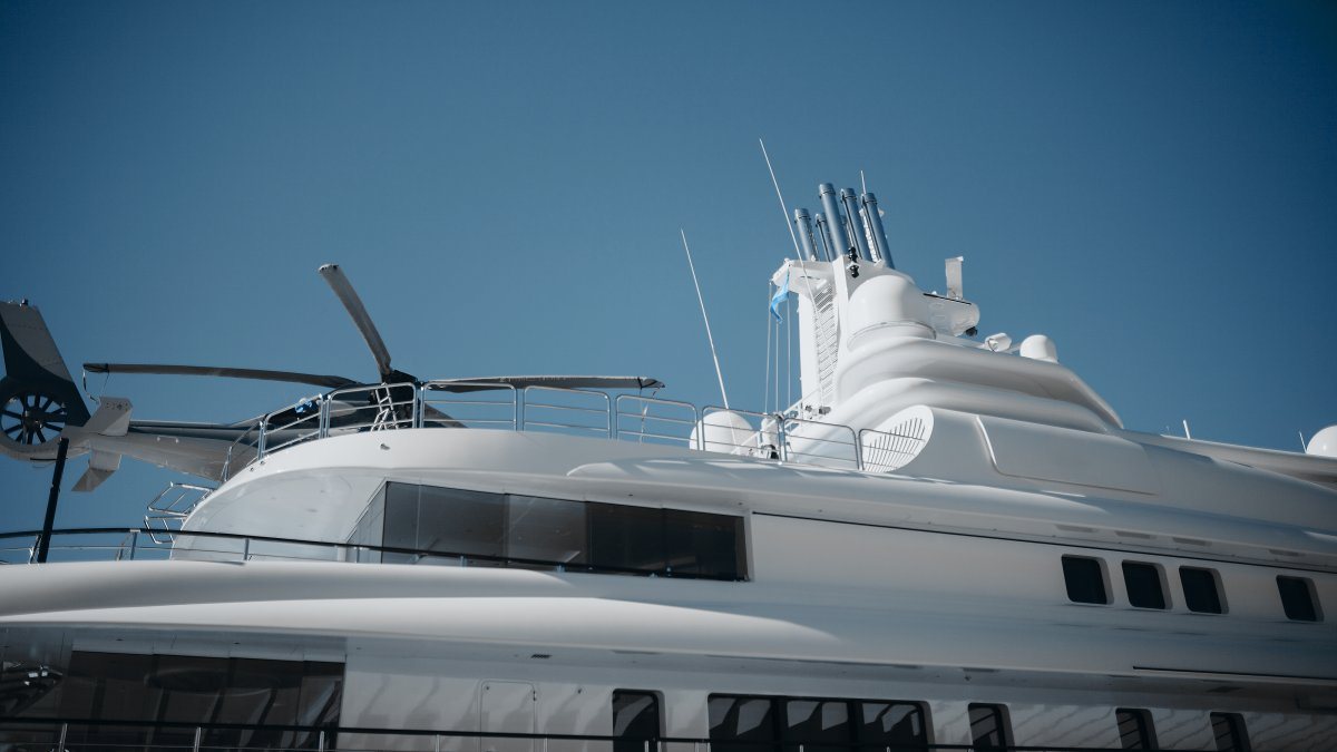 Detail of luxury yacht with helicopter on the top