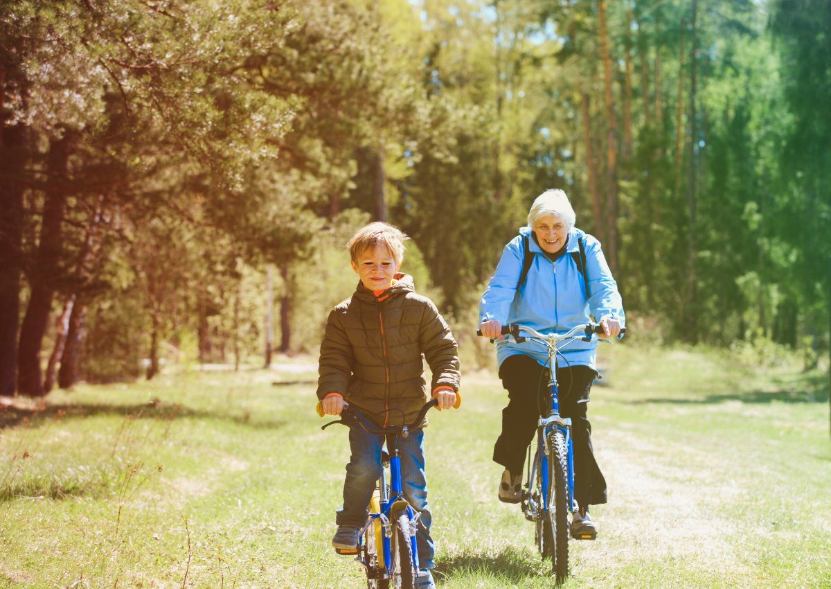 Active Senior Grandmother Grandson Riding Bikes