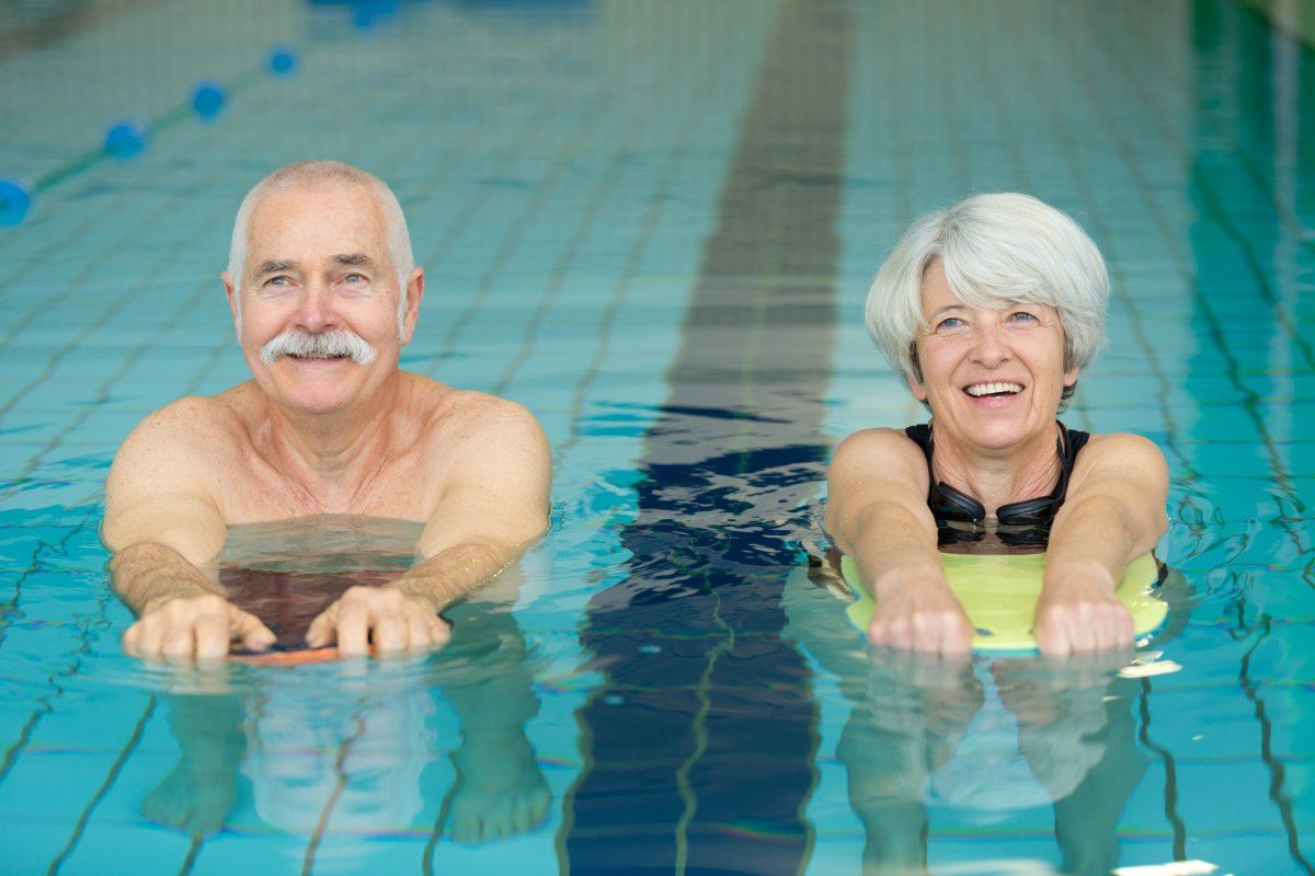 Happy Senior Couple Swimming Pool